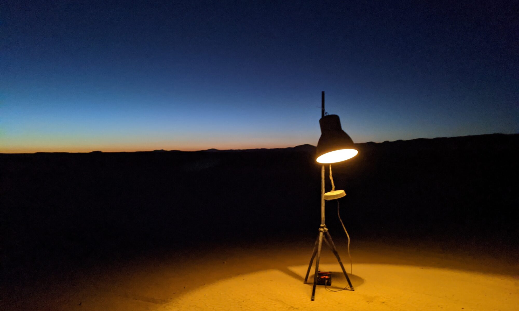 an ikea lamp in the desert at sunset